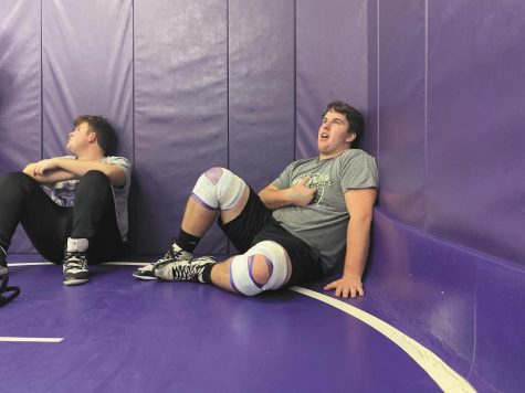 Chatting it up with some teamates, junior Preston Welch prepares to start practice in his third year as a Chieftain wrestler. “Last year’s season was pretty good; we had 3 state medalist two of which were state champions and this year we are looking to build on that,” Welch said. Photo by Jacob Kriewald.