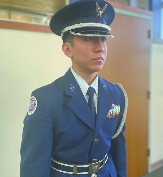 Focused. Waiting for orders, Cadet Chief Master Sgt. junior Ty Yoon stands at attention. “Being in AFJROTC has impacted me because it’s helped me determine a clear goal after high school,” Yoon said.
