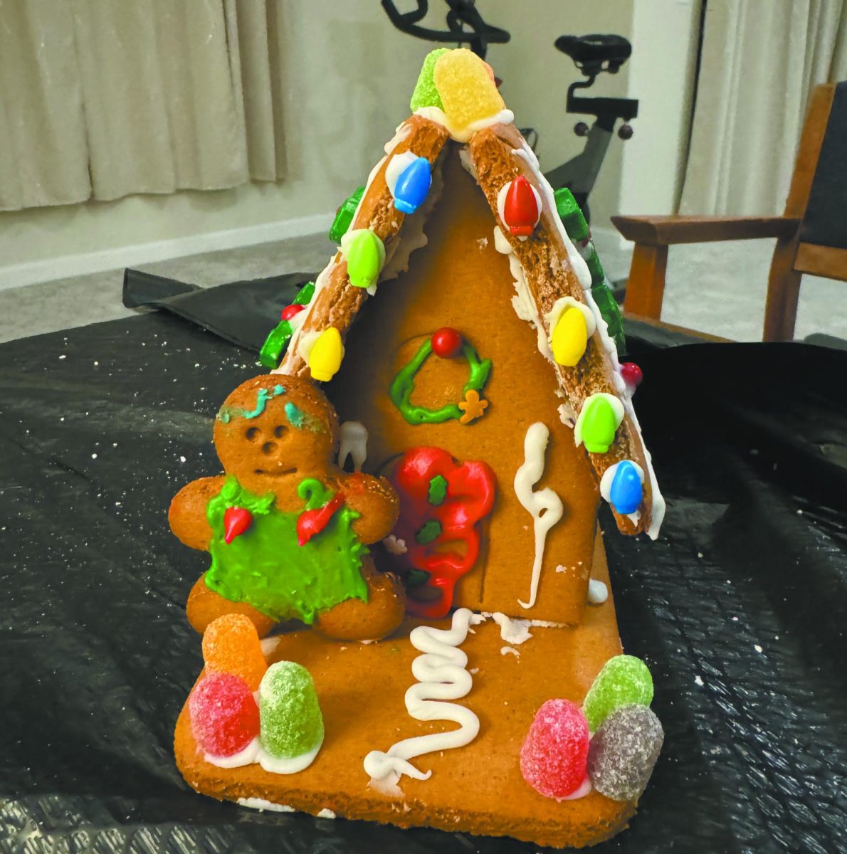 Don%E2%80%99t+fall+off.+While+precarious%2C+sophomore+Brianna+Yang%E2%80%99s+finished+gingerbread+house+stayed+standing+up.+She+said+that+creating+a+gingerbread+house+with+no+expertise+is+harder+than+it+looks.+%E2%80%9CI+underestimated+the+process.+A+very+humbling+experience%2C%E2%80%9D+Yang+said.+