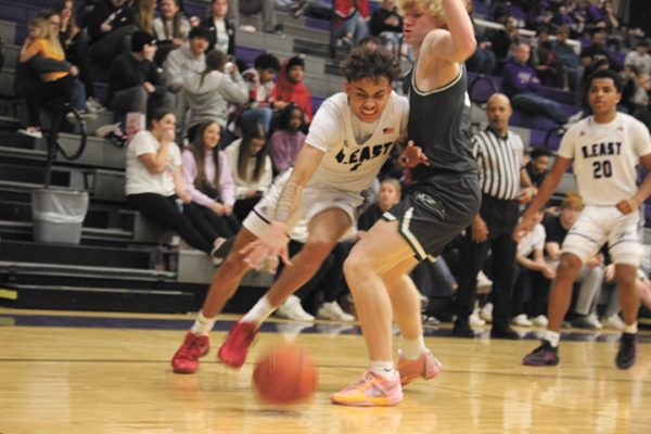 Getting the ball! During the game against Lincoln Southwest High School at Bellevue East on Jan. 27,  junior Kris Brown heads to the basket to score.  After a long battle, Bellevue East lost 55-28. “It feels good, trying to compete to win and doing my part in the team,” Brown said.