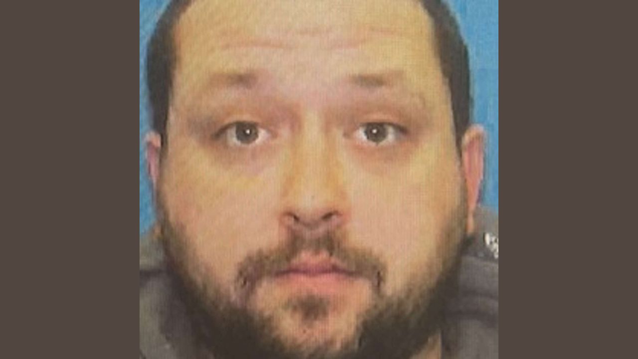 A man was found dead in a small-town greenhouse — now his neighbor is charged with murder
